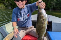 Young Boy with Smallmouth Bass Catch