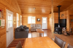 Open Living Space With Wood Stove Heating