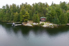 Fly-In Outpost Cabin Along Forested Shoreline