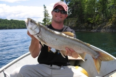 Lake Trout Lifted Toward Sunlit Shoreline