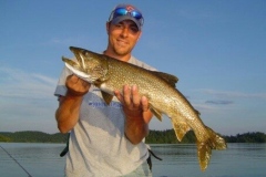 Angler With Lake Trout on Clear Open Lake