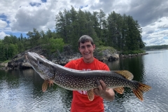 Big Northern Pike Lifted Beside the Dock