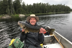 Smiling Angler with Dark-Back Walleye from Deep Water