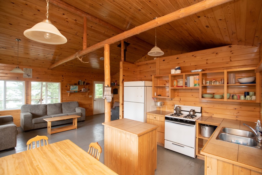 Ajax Cabin interior view. Fridge, Stove, hot water and solar lights