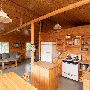 Ajax Cabin interior view. Fridge, Stove, hot water and solar lights