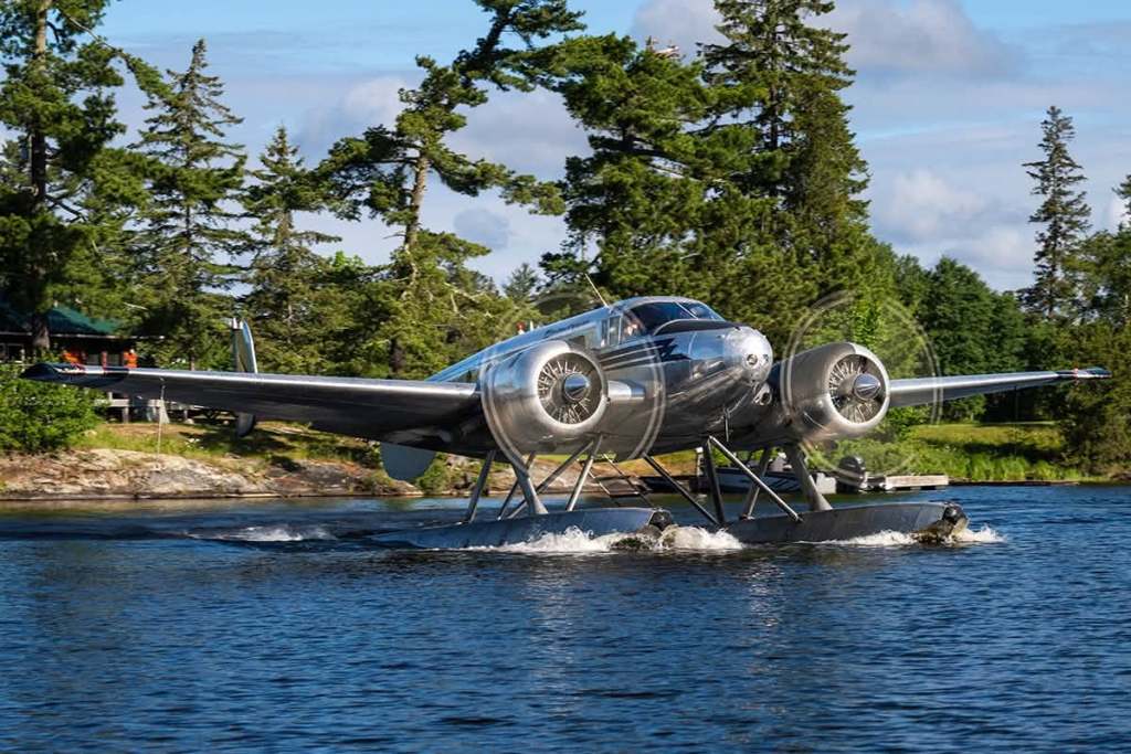 Northwest Flying Beech 18 floatplane powering up for takeoff at Nestor Falls, Ontario, July 2026