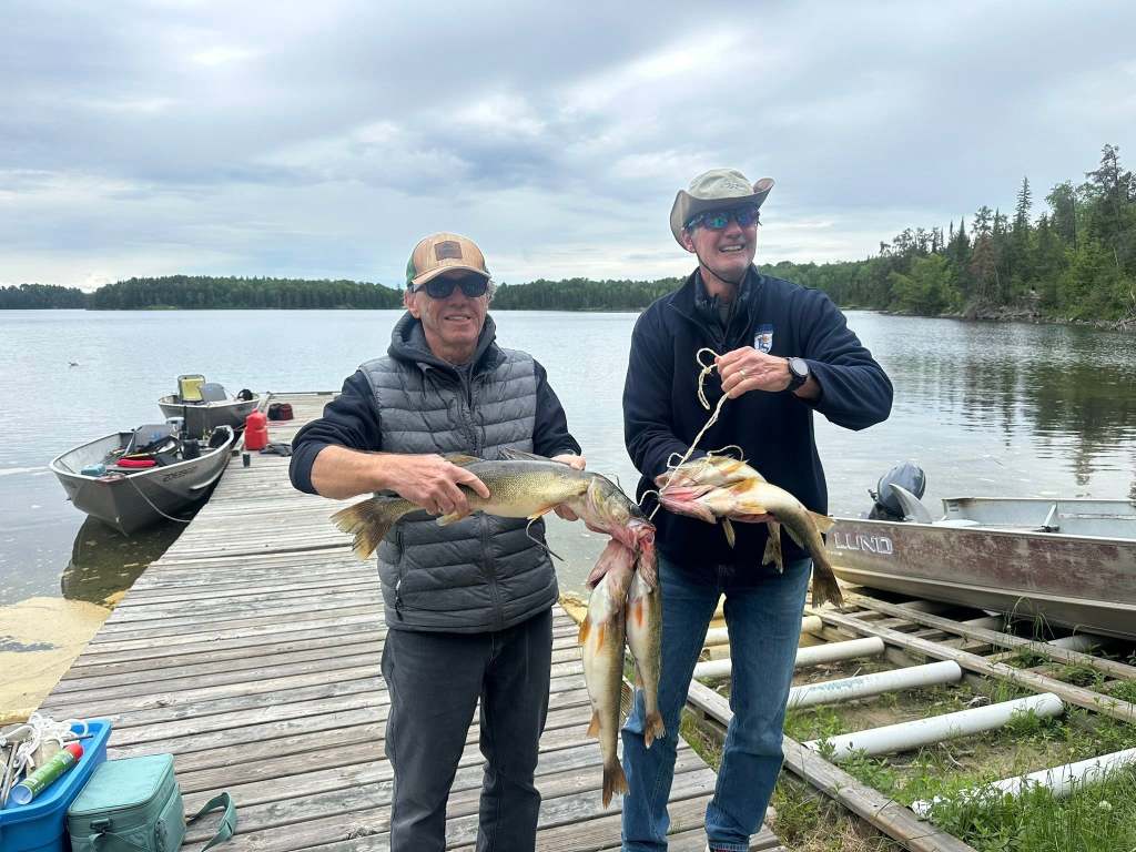 Fresh walleye fillets being cooked for a shore lunch fish fry at the Loonhaunt Lake outpost cabin, June 2026